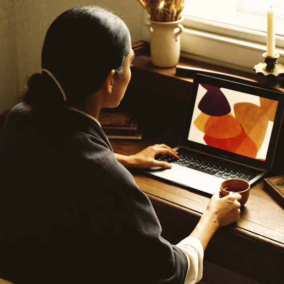A consultant reviewing a generated Vastu report on her laptop